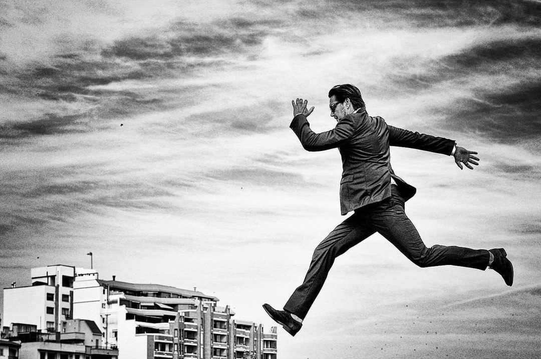 Person jumping across the sky