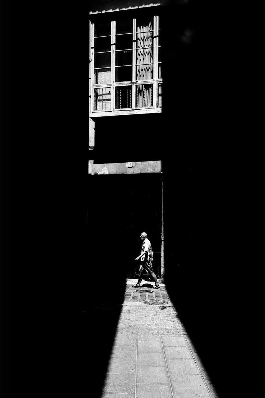 Person in a strip of light in Palma